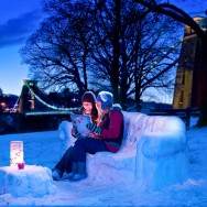Bristol Editorial Photography - Girls sitting on snow sofa in front of Clifton Suspension Bridge at twilight